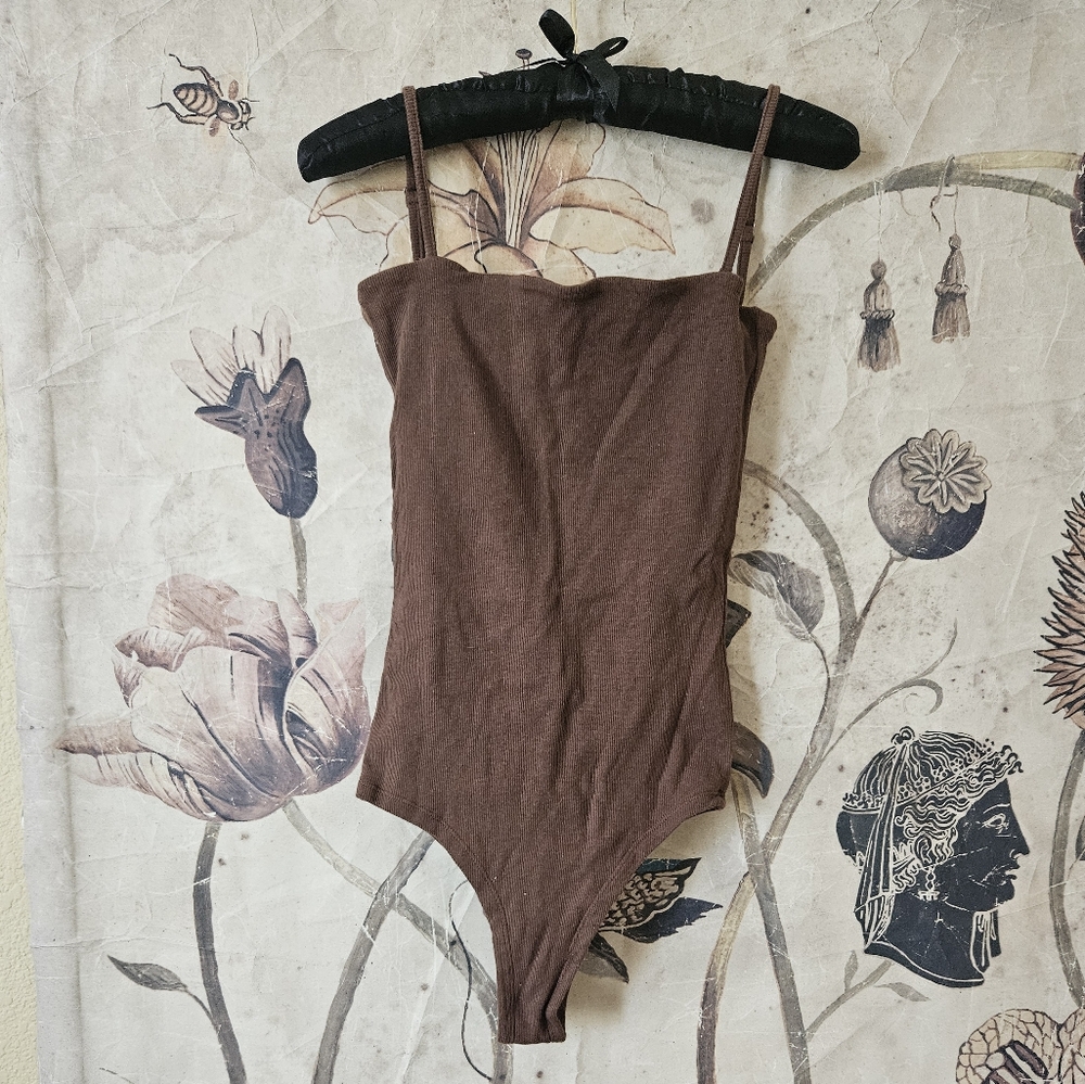 raised by water brown minimalist bodysuit